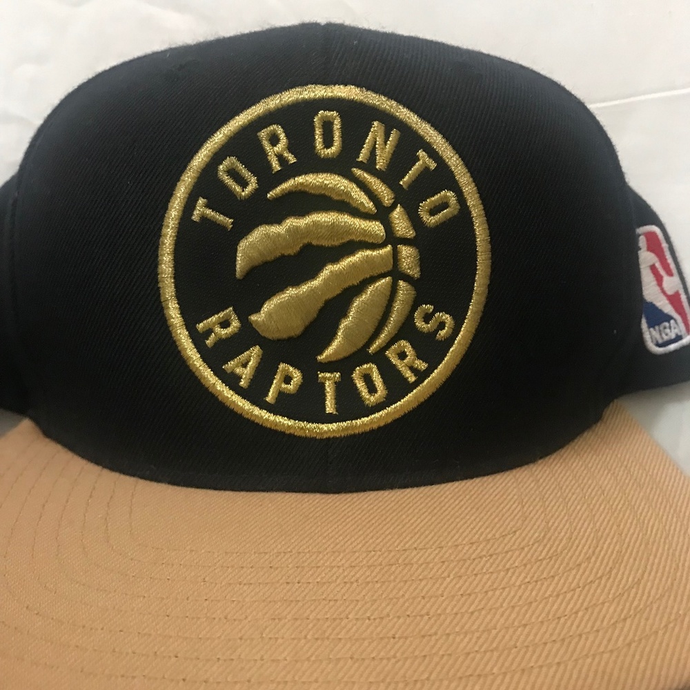 Mitchell &Ness Toronto Raptors NBA Champions Spell Out SnapBack Hat Gold/Black